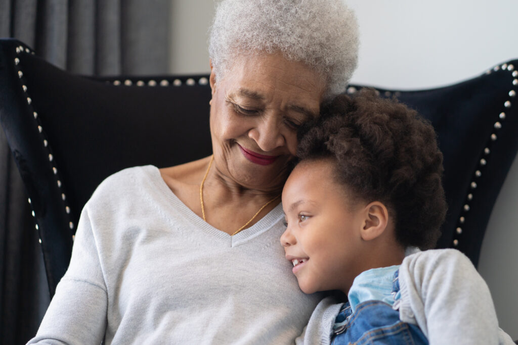 senior sitting with grandchild