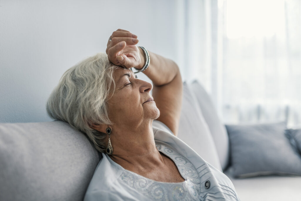 Elderly woman experiences chronic senior fatigue