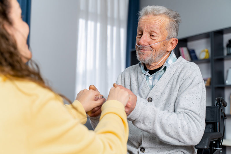 A woman cares for a loved one with COPD in the home.